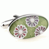 Three flower heads in green oval cufflinks